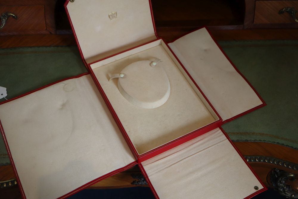 A Cartier Paris gilt tooled red leather necklace box, 26.3cm.